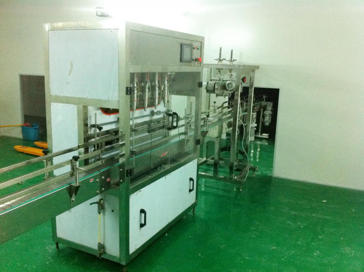 Linear filling machine with 4 filling heads MAȘINĂ DE UMPLEARE LINEARĂ.jpg